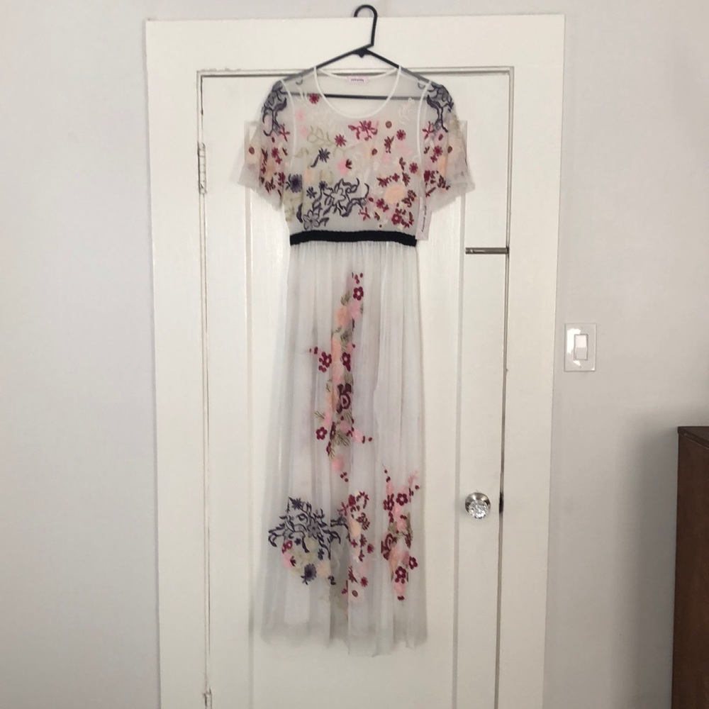 White with embroidered flowers maxi dress.